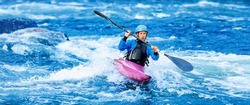 Whitewater kayaking banner, extreme sport rafting. Young woman in kayak sails mountain river.