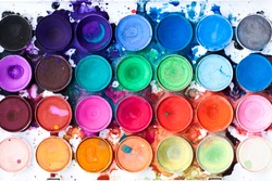 Watercolor paint palette, bright, colorful paint splatters