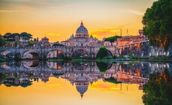 St. Peter's basilica in Rome,Vatican, the dome at sunset with reflection