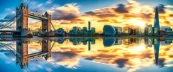 Tower Bridge sunset panorama with reflection in London. England