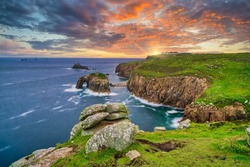 Land's End with Enys Dodman arch sunset in Cornwall. United Kiongdom