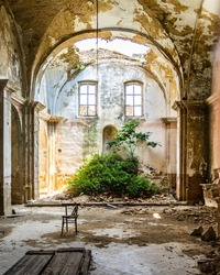Interior of an abandoned church in Craco, a ghost town in Basilicata region abandoned due to a landslide, Italy