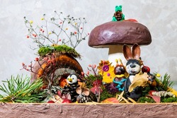 Animals and a mushroom are made of plasticine. Children's hobby. Composition of soft colored material for creativity. Autumn concept.