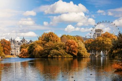 View towards St. James Park in London during autumn season with golden trees and sunshine, United Kingdom