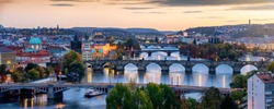 Beautiful view to the illuminated cityscape and bridges of Prague, Czech Republic, including the famous Charles Bridge and old town just after sunset time