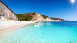 Panoramic view of the beautiful Fteri Beach on the island of Kefalonia, Greece, with turquoise, clear sea and sunshine