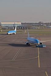 An incoming aircraft and a departing aircraft