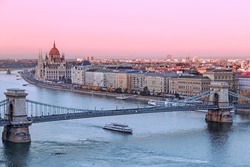 Picturesque dusk scenery of Budapest historical downtown over Danube river delta.