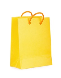 Yellow bag with purchases on the white