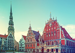 Hall square with museum of House of Blackheads and Saint Peter church, Riga. English translation for Latvian text is 