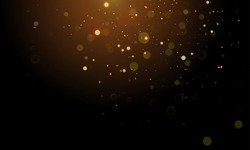 Abstract glitter light on black background with gold bokeh