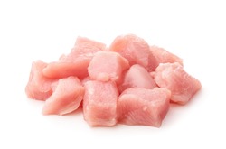 Raw chicken fillet chunks isolated on white