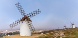 View of historic whitewashed windmills in La Mancha