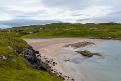 the Scottish Highlands coastline and the beauitful golden pink sand beach of Clashnessie in Sutherland