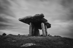 A black-and-white long exposure view of the Poulnabrone Dolmen in County Clare of Western Ireland