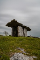 A long exposure view of the Poulnabrone Dolmen under an overcast sky in County Clare of Western Ireland