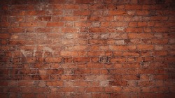 Red brick pattern. Old brick wall with cracks and scratches. Horizontal wide brickwall background. Distressed wall with broken bricks texture. Vintage house facade.