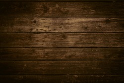 Wood texture in warm golden and brown tones. Old rural wooden wall, detailed plank fence photo background. Natural wooden building structure.