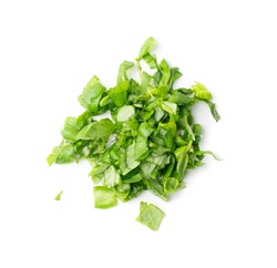 Fresh green chopped basil leaves isolated on white background. Spicy aromatic sliced raw basilic or ocimum herbs top view