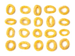 Corn single rings set isolated. Cheese puffs with spices, crunchy round puffed snacks, salty corn rings top view