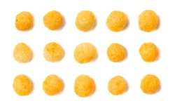 Corn balls set isolated. Cheese single puffs with spices collection, crunchy snacks, scattered salty corn balls top view