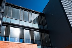 Modern office buildings with black glass window.
