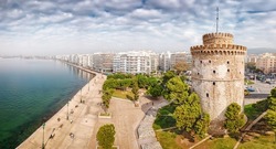 Aerial panoramic view of the main symbol of Thessaloniki city and the whole of Macedonia region - the White Tower. Concept of travel destinations in Greece and urban development.