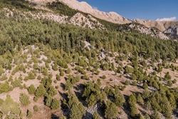 The view from above reveals an expansive landscape, with the Taurus mountains stretching far into the distance and creating an impressive vista.