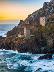 The ruins of the Crowns Engine Houses perched on the granite cliffs at Botallack in Cornwall. Taken at sunset and a  film location for TV period drama Poldark.