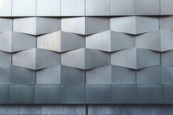 Wall of black metal futuristic new building. Abstract architectural pattern