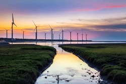 Scenery of Gaomei Wetlands wind turbines during golden hour in Taichung
