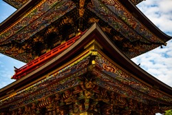 Close up photograph of the Sanju-no-to Three Storied Pagoda standing 25 meters tall and constructed in 1712 in Naritasan Shinshoji Temple - a Shingon sect Buddhist temple in Narita, Chiba, Japan.