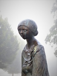 statue woman crying mist wet