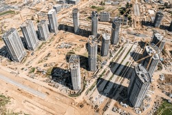 new urban residential area under construction. aerial view from the drone at sunny day.