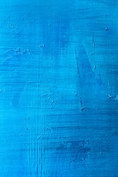 abstract hand painted blue paint canvas background 