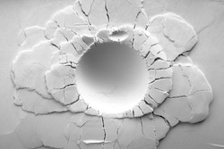 A crater on white powder background. Round crater with cracks.   