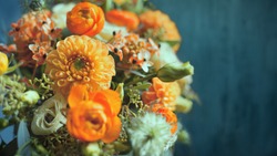 The bouquet of different orange flowers