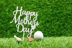 Baseball for mom on Mother's Day with baseball on green grass background