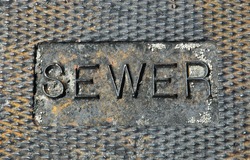 rusty sewer plate