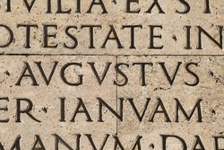 Latin ancient language. Inscription from the famous Res Gestae (1st century AD), with the word Augustus in the center