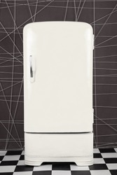 old vintage white refrigerator on a deep background. Vertical frame