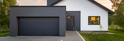 Panoramic view of modern house with garage and green lawn