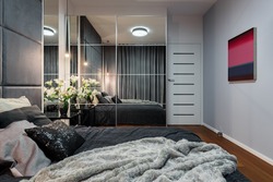 New design bedroom with bed, mirrored wardrobe and modern painting