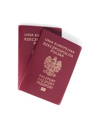 Two Polish passports on a white background.