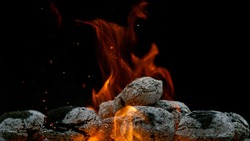 Barbecue Grill Pit With Glowing And Flaming Hot Charcoal Briquettes, Close-Up