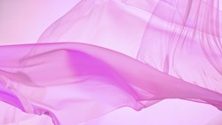 Pastel color transparent silk fabric flowing by wind, freeze motion