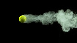 Freeze Motion Shot of Flying Tenis Ball Containing Light Green Powder