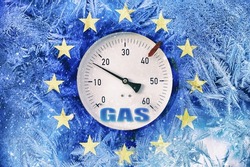 gas pressure gauge on background of frozen flag of European Union, energy crisis in European countries in the winter season, transition to renewable energy sources, the increase in natural gas prices