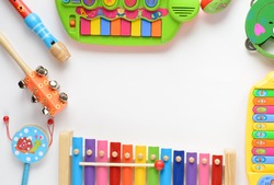 frame made of music accessories for children on white background. top view