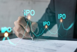 Businessman in suit signs paper. Double exposure with IPO icon hologram. Man signing contract agreement. Primary stock issue market analysis and investment concept.